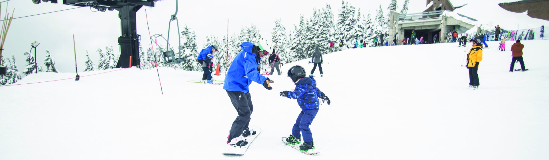Banner ski instructor with child